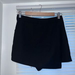 Black shorts/skirt in one.